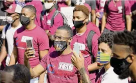  ?? Melissa Phillip/Staff file photo ?? Texas Southern University students rally at an early voting kickoff event in 2020. Rep. Carrie Isaac has proposed banning voting on college campuses.