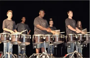  ??  ?? Above: The Rome High School drum line performs a number at the first-ever Rome City Schools Super Showcase at the Forum River Center on Thursday evening.