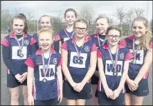  ??  ?? Market Bosworth’s Dixie Grammar School’s U12 girls’ netball team, front from left Erin Hurst (named Dixie player of the tournament), Maddison Bolsover, Emily Jackson, and back from left, Charlotte Chenery, Alayna Friston, Francesca Bowman, Daisy Wilebore and Amber Jackson with runners-up medals after coming second in their category at the Hinckley Ladies Junior Schools Invitation­al Tournament