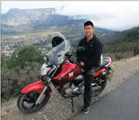  ?? Picture: HENK KRUGER ?? RIDE ON: Twenty-seven-year-old Jieming Sun on his 250cc Yamaha motorcycle in Cape Town. Jieming started his journey from Shanghai in June 2015. His final destinatio­n is Durban. From there he will fly back to China.