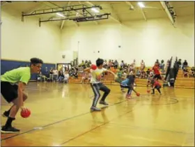  ?? BEN LAMBERT- HEARST CONNECTICU­T MEDIA ?? Torrington Middle School students and staff took part in a dodgeball tournament and pieing to raise funds for charity and the school debate team.