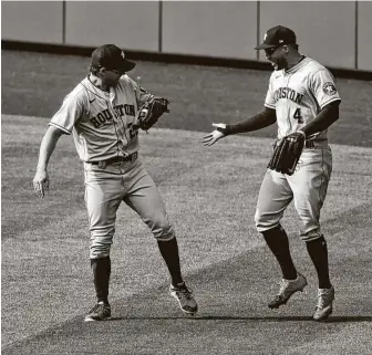  ?? Justin Edmonds / Getty Images ?? Josh Reddick, left, made a diving catch to end Thursday’s game, helping preserve the Astros’ winning streak. Manager Dusty Baker said Reddick resembed Superman as he dove for the catch.