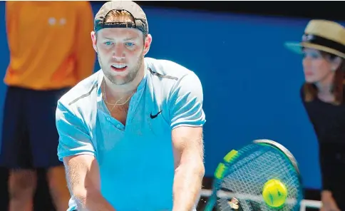  ?? — AFP photo ?? Jack Sock of the US hits a return against Yuichi Sugita of Japan during their fifth session men’s singles match on day four of the Hopman Cup tennis tournament in Perth on January 2, 2018.