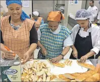  ?? CHEF ILONA DANIEL/THE GUARDIAN ?? These three women, who work for the Canadian Embassy in Ethiopia’s capital, Addis Ababa, had a chance to learn about Canadian cuisine from chef Ilona Daniel, in tandem with the Canadian diplomatic mission of raising the status of women and children in that country. They are working with bread to be used as part of a beef tenderloin dish that was served at the Canada 150 celebratio­ns at the embassy.