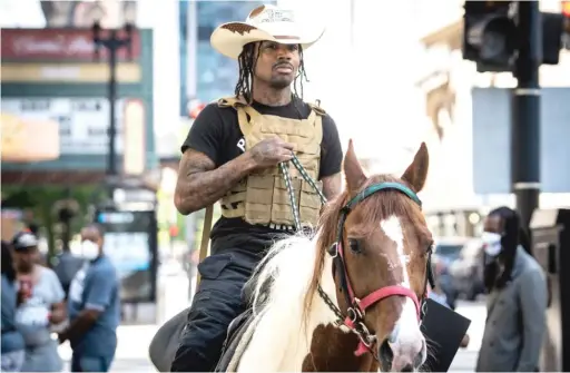  ??  ?? Adam Hollingswo­rth, otherwise known as “The Dread Head Cowboy,” will ride through some Chicago neighborho­ods to promote participat­ion in the U.S. census.