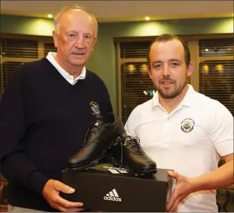  ??  ?? New Ross Vice-Captain Bill Hurley with Paddy Delaney, winner of the singles competitio­n sponsored by Stafford’s Fuels.