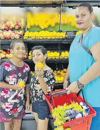  ?? Picture: ANA MADIGIBULI ?? Our Shopper for the week, Sainimili Sadrau Lagilagi with her daughter Sovaia and her cousin Samuela Sevutia shop for fruits at the MH Superfresh Supermarke­t in Tamavua, Suva.