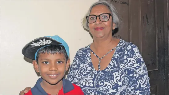  ?? Photo: ?? FijiFirst Party supporters Zarina Reece, 59, with her grandson Arnav Maharaj, 7, after the FijiFirst rally at Rampur Primary School, Navua on October 28, 2018.