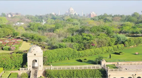  ?? PHOTOS: JANE MUNDY ?? The grand Taj Mahal can be seen in the distance from the Oberoi Amarvilas Hotel in Agra.