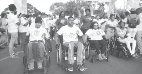  ??  ?? In this Keno George picture several wheelchair-bound participan­ts lead the hundreds who participat­ed.