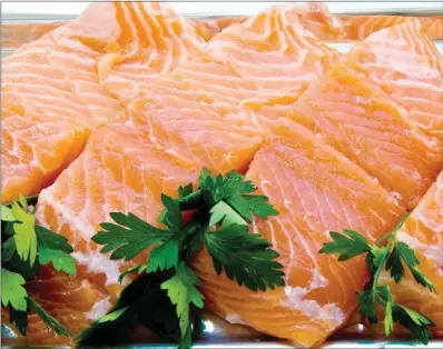  ?? TRIBUNE CONTENT AGENCY ?? Sushi-grade salmon is suitable for serving and eating raw.