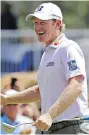  ?? THE ASSOCIATED PRESS ?? Brandt Snedeker grins after sinking a birdie putt on the ninth hole at the Wyndham Championsh­ip on Thursday.