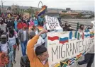  ?? GUILLERMO ARIAS/AFP VIA GETTY IMAGES ?? Migrants and asylum seekers protest Title 42 near the U.S.-Mexican border in Tijuana, Mexico, in May.