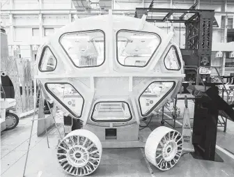  ?? Mark Mulligan / Staff photograph­er ?? A newer version of a Lunar Electric Rover inside the Space Vehicle Mockup Facility at the Johnson Space Center. The Lunar Rover project was halted in April.