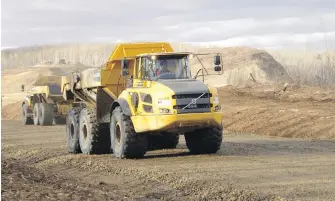  ?? B.C. HYDRO ?? Trucks hauling materials on the north bank of the Site C dam site.