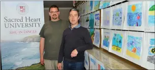  ??  ?? Professor Mark Beekey and SHU Dingle Campus Director Seán Pól Ó Conchúir with some of the entries in the competitio­n which invited schoolchil­dren to to design a poster for the Sea Land and Spirit Coastal Environmen­t Ireland conference being held in the...