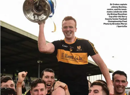  ??  ?? Dr Crokes captain Johnny Buckley, centre, and his teammates celebrate with the Bishop Moynihan Cup after the Kerry County Senior Football Championsh­ip Final Photo by Brendan Moran / Sportsfile