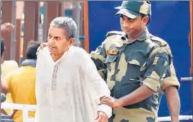  ?? HT PHOTO ?? Gajanand was among 30 others who were received by BSF officials at Wagah border on Monday.