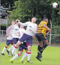  ??  ?? Saints new signing David McPhee heads clear during the 1- 0 win over Alloa.