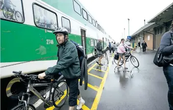  ?? JULIE JOCSAK/STANDARD FILE PHOTO ?? In this file photo, cyclists get off a GO Bike Train that rolled into the St. Catharines train station.