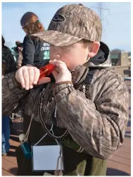 ?? (Special to The Commercial/Richard Ledbetter) ?? Titon Allen demonstrat­es the proper way to blow his new Legendary Gear duck call, given to every student for their participat­ion.