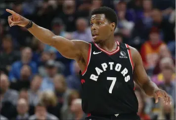  ?? RICK BOWMER — THE ASSOCIATED PRESS ?? Toronto Raptors guard Kyle Lowry directs his team in the first half against the Utah Jazz on Monday in Salt Lake City.