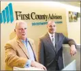  ?? Hearst Connecticu­t Media file photo ?? First County Bank Chairman and CEO Reyno Giallongo, left, and Senior Vice President of Retail Banking Willard Miley at the First County headquarte­rs at 3001 Summer St. in Stamford.