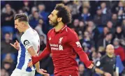  ?? (AFP) ?? Liverpool's Mohamed Salah celebrates after scoring from the penalty spot against hosts Brighton on Saturday