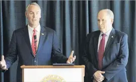  ?? Mark Thiessen Associated Press ?? INTERIOR SECRETARY Ryan Zinke, left, with Alaska Gov. Bill Walker, discusses his order in May to create a new plan for energy exploratio­n in the Arctic.