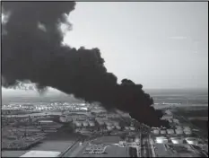  ?? Associated Press ?? A plume of smoke rises from a petrochemi­cal fire at the Interconti­nental Terminals Company in Deer Park, Texas, in March.