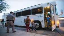  ?? MICHAEL CHOW — THE ARIZONA REPUBLIC VIA AP, FILE ?? In this May 28, 2014, file photo, migrants are released from ICE custody at a Greyhound bus station in Phoenix.