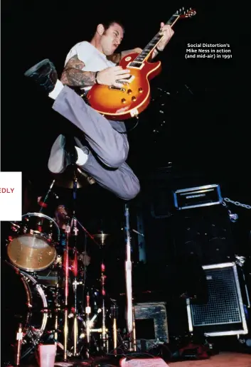  ?? ?? Social Distortion’s Mike Ness in action (and mid-air) in 1991