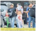  ?? EPA ?? ABOVE Plaincloth­es policemen detain a suspect after an attempted suicide bombing at St Yoseph Catholic Church in Medan, Indonesia, yesterday.