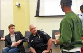  ?? CHRISTINE WOLKIN — FOR DIGITAL FIRST MEDIA ?? Lansdale Mayor Garry Herbert and Lansdale Police Chief Mike Trail listen to a community member’s concerns during Lansdale’s Community Forum on Racism at Lansdale’s Borough Hall.