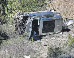  ?? HARRISON HILL/ USA TODAY ?? Rescue workers extricated Tiger Woods from a mangled SUV after an accident in California on Tuesday.