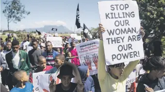  ?? Picture: Ashraf Hendricks ?? NO MORE: Elsies River residents marched against violence on Tuesday following the murders of three children and a teenager last week.