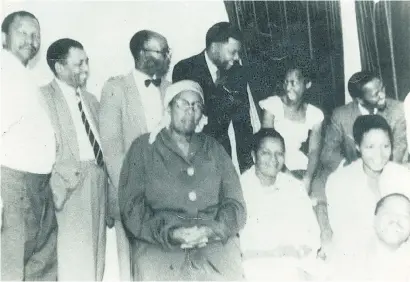  ?? Picture: Family album ?? THEN. Back: Phillip Matthews, Walter Sisulu, Barney Ngakane, Nelson Mandela, Emily Marokoane and Nthato Motlana. Front: May Ngakane, Sally Motlana and Winnie Madikizela-Mandela and an unidentifi­ed comrade sitting in front of them at the Matthews house...