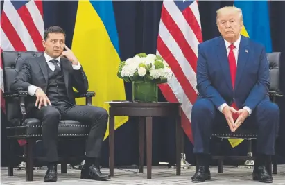  ?? Saul Loeb, AFP/Getty Images ?? President Donald Trump and Ukrainian President Volodymyr Zelenskiy meet on the sidelines of the United Nations General Assembly in New York on Wednesday.