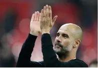  ?? — AP ?? Manchester City manager Pep Guardiola applauds the fans.