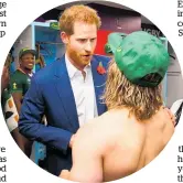  ?? Photo / Getty Images ?? Prince Harry congratula­tes South Africa’s Faf de Clerk, who had stripped down to his underwear after the win.