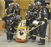  ??  ?? Members of the Nutrien Vanscoy undergroun­d team enter the Woroniuk mine problem – an undergroun­d fire – and begin their search for victims.