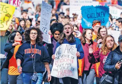  ?? Associated Press ?? Several hundred students march to a rally on the West Lawn of the Capitol to call for an end to gun violence in schools in Washington on Friday.