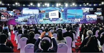  ?? REN CHAO / XINHUA ?? Participan­ts at the opening ceremony of the 2021 Zhongguanc­un Forum, which highlights the applicatio­n of new technologi­es, products and materials.