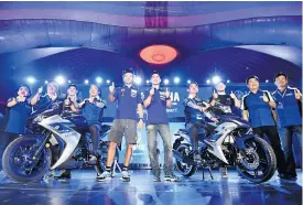  ??  ?? Yamaha riders Valentino Rossi, left, and Jorge Lorenzo at a promotiona­l event at Chang Internatio­nal Circuit.