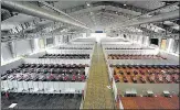  ?? ANI ?? Beds at a temporary Covid-19 care centre at Bengaluru Internatio­nal Exhibition Centre on Monday.