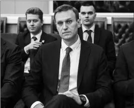  ?? EVGENY FELDMAN/NAVALNY CAMPAIGN VIA AP ?? RUSSIAN OPPOSITION LEADER ALEXEI NAVALNY, who submitted endorsemen­t papers necessary for his registrati­on as a presidenti­al candidate, center, sits at the Russia’s Central Election commission in Moscow, Russia, on Monday. Russian election officials...