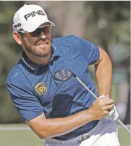  ??  ?? Louis Osthuizen of South Africa shares the lead Friday at The Players Championsh­ip in Ponte Vedra Beach, Fla.