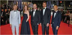  ?? — AFP ?? (From left) Norwegian actor Anders Danielsen Lie, Norwegian actress Renate Reinsve, Danish director Joachim Trier, Norwegian actor Herbert Nordrum and Norwegian screenwrit­er Eskil Vogt pose as they arrive for the screening of the film “Verdens Verste Menneske” (The Worst Person In The World) at the 74th edition of the Cannes Film Festival in Cannes.