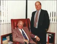  ?? NEWS-HERALD FILE ?? Richard G. Small, president and CEO of Cleveland Constructi­on Inc., seated, is shown with his son, Mark T. Small, senior vice president of the company. Cleveland Constructi­on of Mentor ranked as the No. 1 Establishe­d company on the Fast Track 50 in...