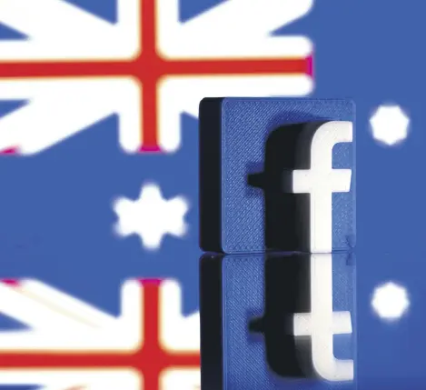  ??  ?? A 3D-printed Facebook logo is seen in front of an Australian flag in this illustrati­on photo, Feb. 18, 2021.